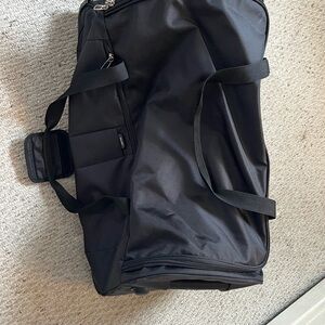 Delsey - Black Duffel Bag with handle and wheels (never used)